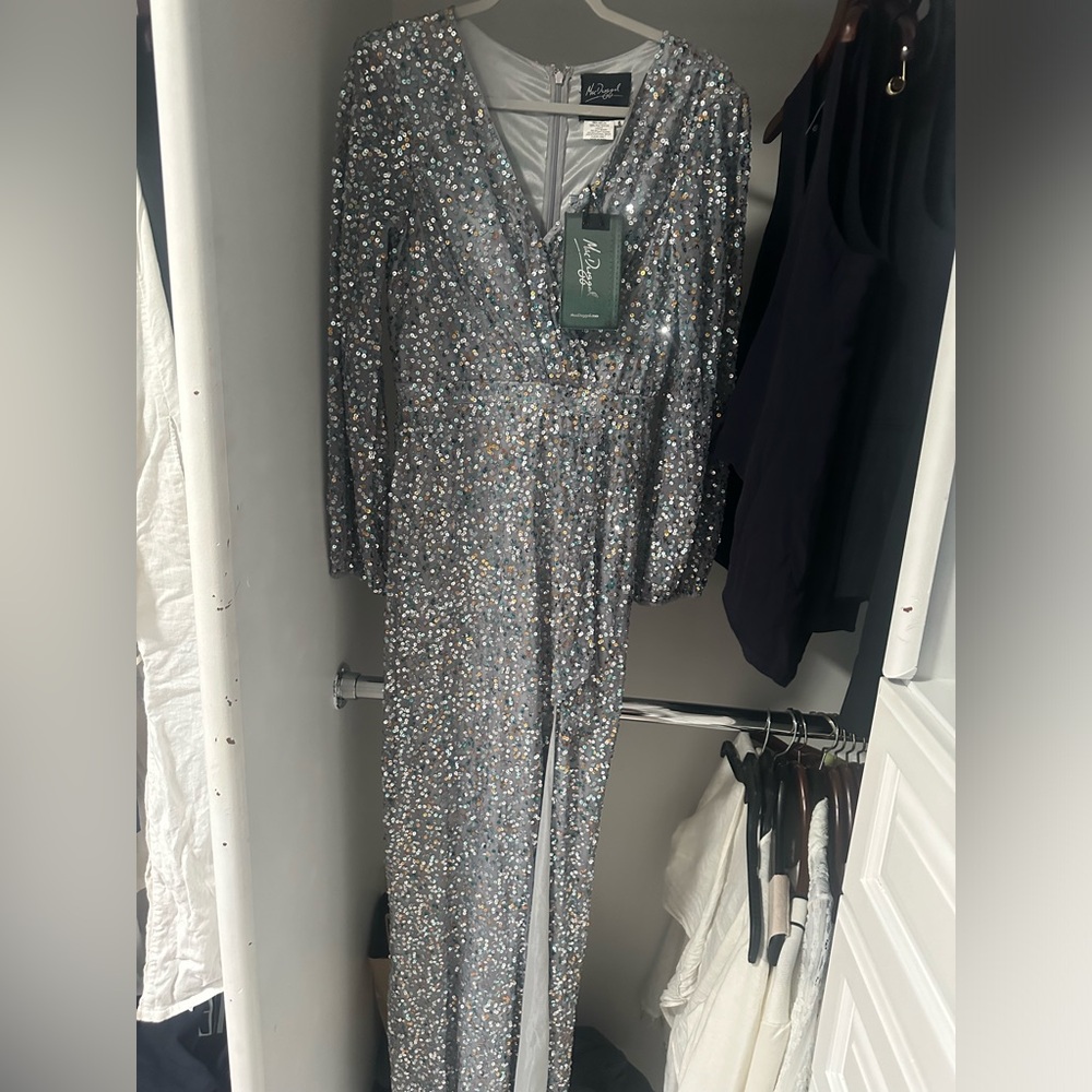 Beautiful sequence maxi dress with a slit. Never worn brand new six 6.